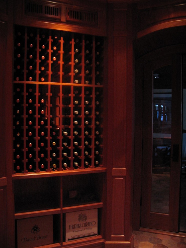 This is an example of an eclectic wine cellar in Milwaukee.