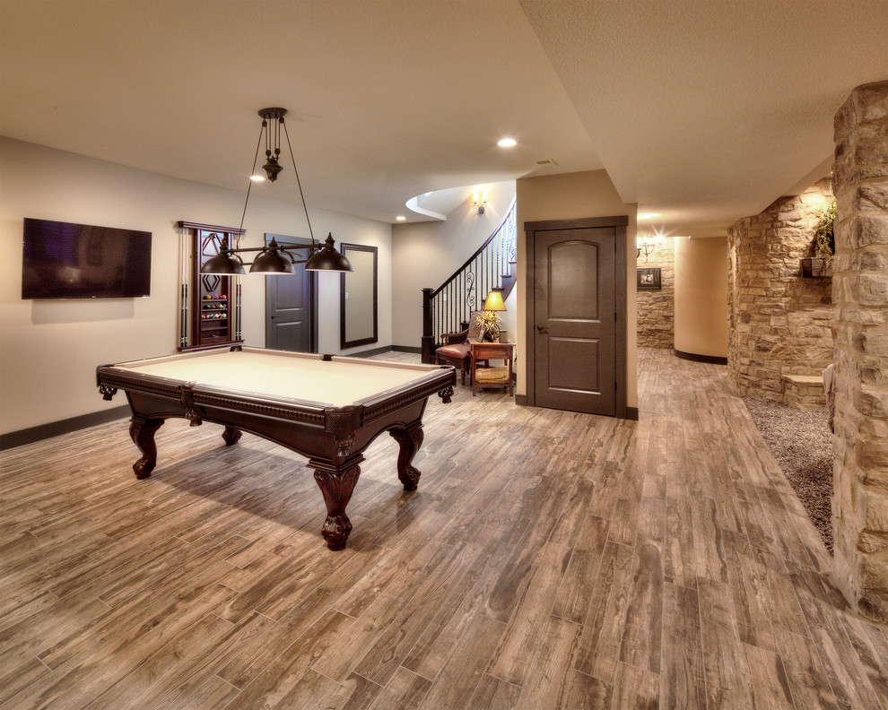 This is an example of a mediterranean basement in Kansas City with beige floor.
