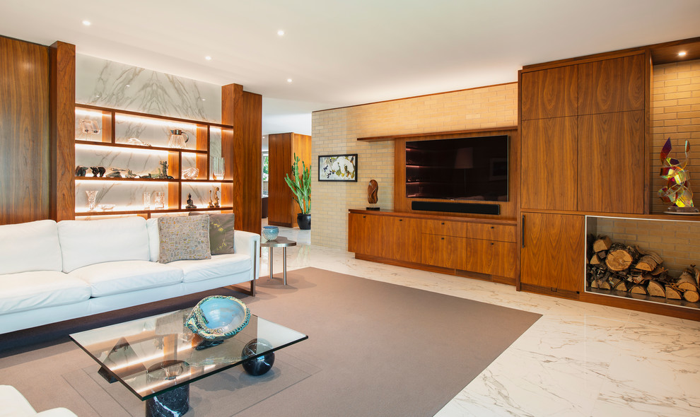 Inspiration for a large midcentury open concept family room in Other with a music area, marble floors, a standard fireplace, a brick fireplace surround, a wall-mounted tv and white floor.