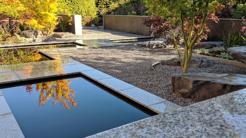 Photo of a mid-sized contemporary backyard formal garden in Cheshire.
