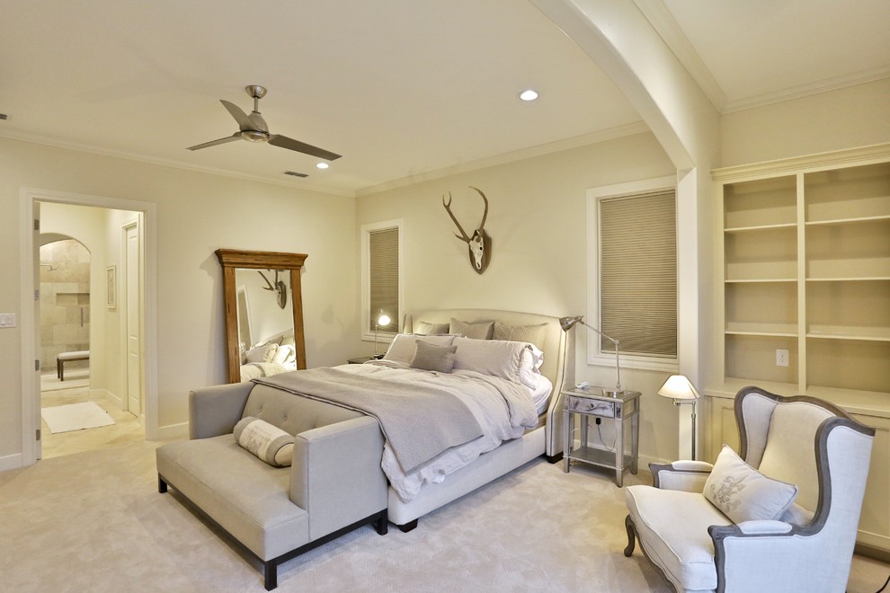 Inspiration for a mid-sized transitional master bedroom in Austin with beige walls, carpet and beige floor.