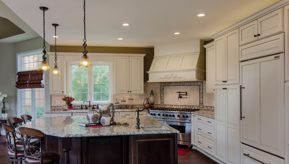 Inspiration for a mid-sized transitional l-shaped dark wood floor open concept kitchen remodel with raised-panel cabinets, white cabinets, white backsplash, paneled appliances and an island