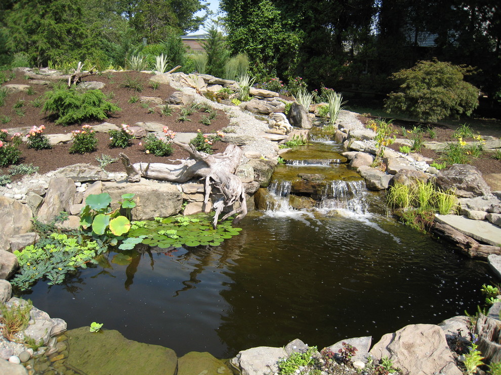 Photo of a traditional garden in Philadelphia with a water feature.