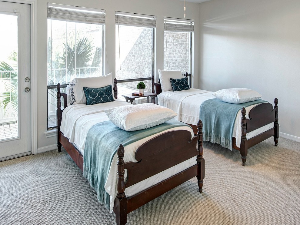 This is an example of a small traditional guest bedroom in Houston with grey walls, carpet, no fireplace and beige floor.