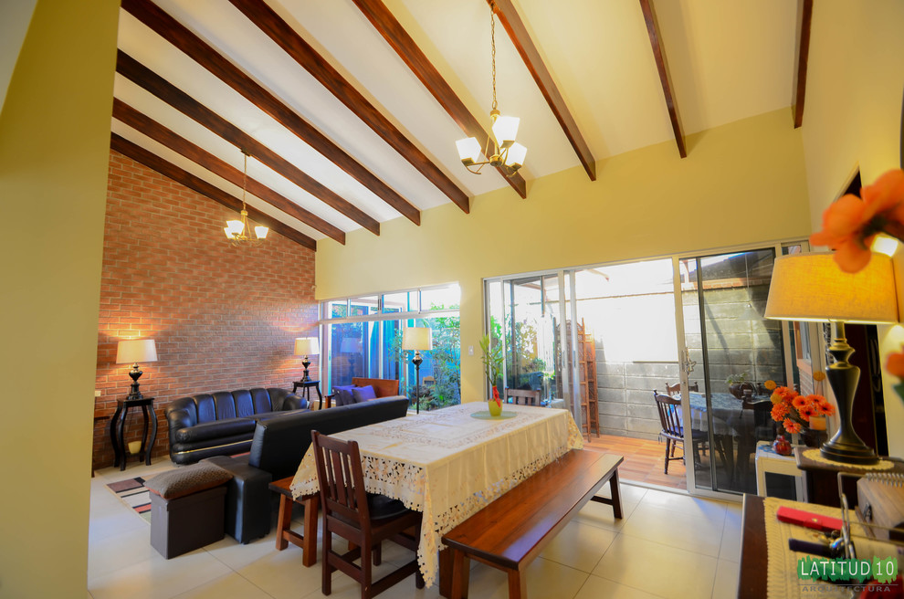 Small mountain style porcelain tile home design photo with yellow walls and no fireplace