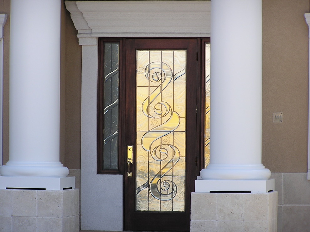 Example of a mid-sized mountain style front door design in Miami with beige walls and a dark wood front door