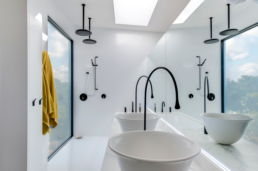 Inspiration for a large modern master wet room bathroom in Sydney with an undermount tub, a wall-mount toilet, white walls, porcelain floors, a vessel sink and marble benchtops.