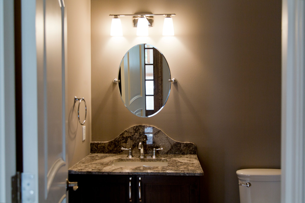 Design ideas for a mid-sized transitional 3/4 bathroom in St Louis with dark wood cabinets, a one-piece toilet, beige walls, ceramic floors, a drop-in sink and granite benchtops.