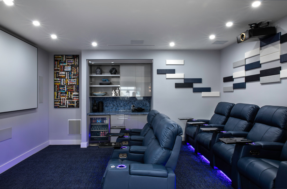 Inspiration for a contemporary enclosed home theatre in Miami with grey walls, carpet, a projector screen and black floor.