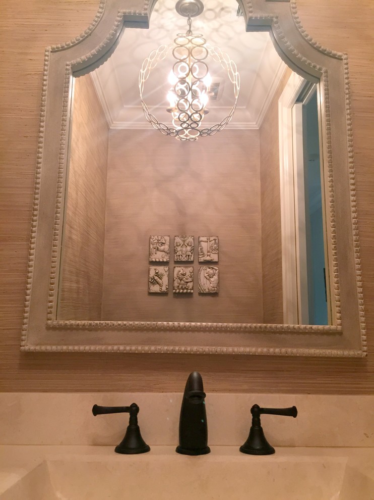 Inspiration for a small transitional dark wood floor bathroom remodel in DC Metro with an integrated sink, furniture-like cabinets, medium tone wood cabinets, marble countertops, a one-piece toilet and beige walls