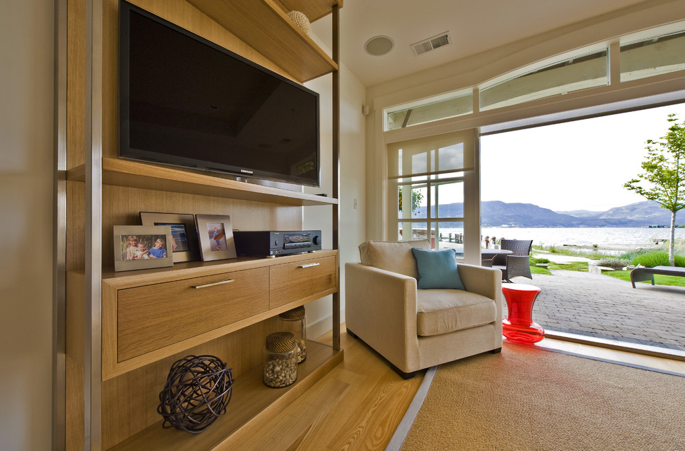Design ideas for a beach style living room in Vancouver with a wall-mounted tv.