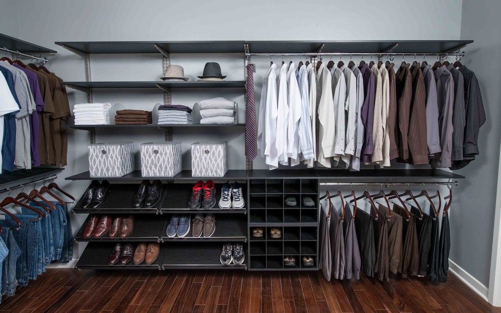 Photo of a large contemporary men's walk-in wardrobe in New Orleans with open cabinets, black cabinets and dark hardwood floors.