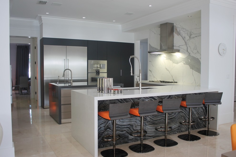 Mid-sized contemporary l-shaped kitchen in Miami with white cabinets, an integrated sink, marble benchtops, grey splashback, ceramic splashback, marble floors, multiple islands and beige floor.