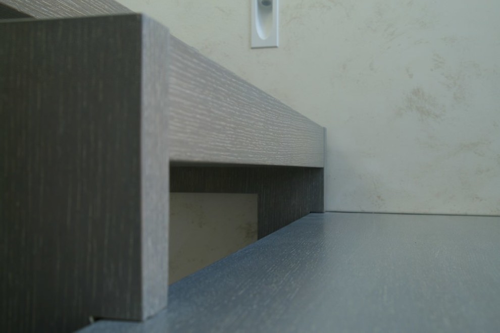 Modern metal stair covered by patina oak