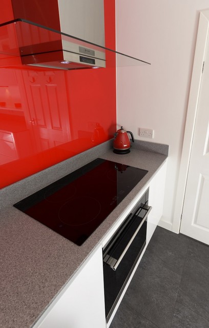 Modern white kitchen with accent red splashback contemporary-kitchen
