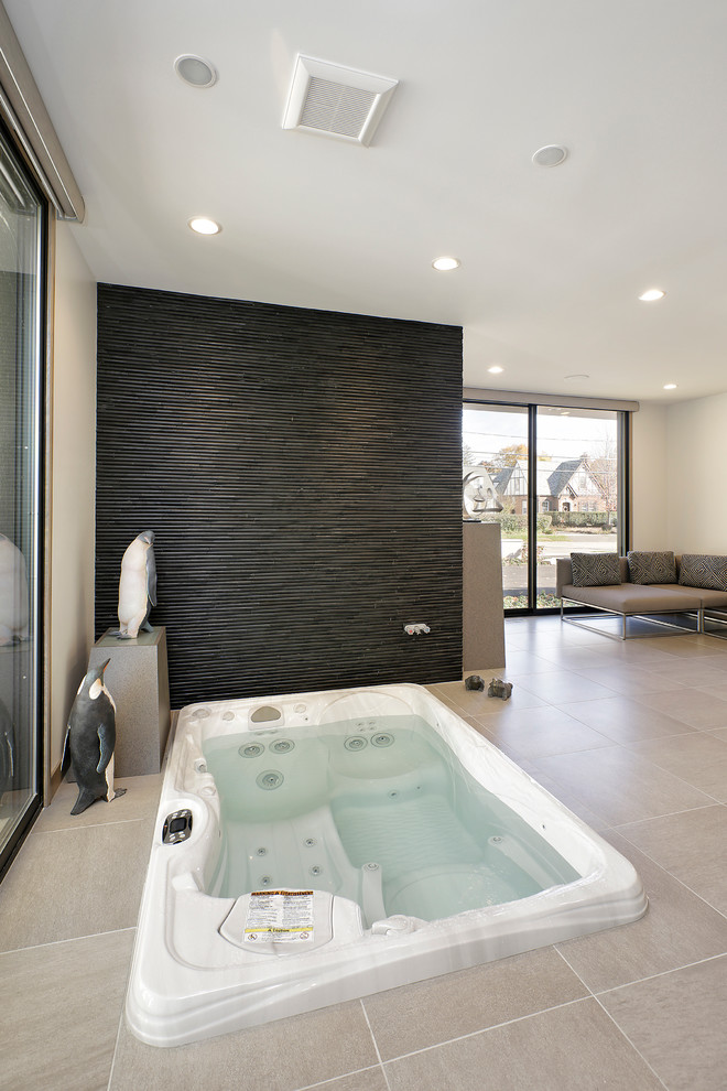 Expansive contemporary master bathroom in Chicago with flat-panel cabinets, light wood cabinets, a hot tub, an alcove shower, white walls, porcelain floors, solid surface benchtops, beige floor and a hinged shower door.