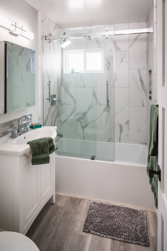 Inspiration for a small transitional 3/4 bathroom in San Diego with furniture-like cabinets, white cabinets, an alcove tub, an alcove shower, gray tile, porcelain tile, white walls, linoleum floors, an integrated sink, brown floor, a sliding shower screen and white benchtops.