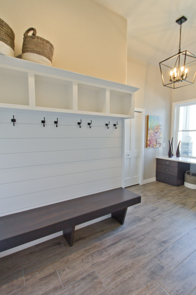 Example of a transitional ceramic tile entryway design