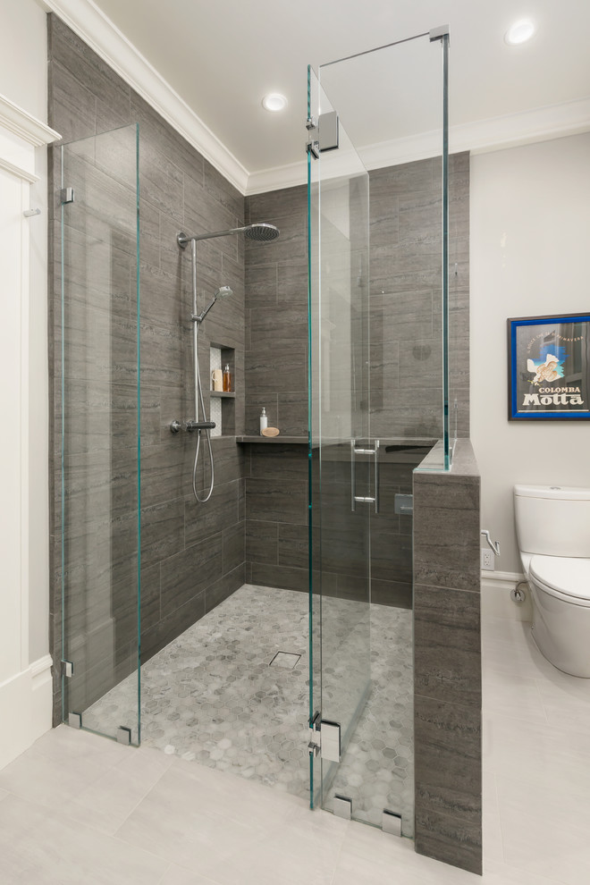 Photo of a large transitional master bathroom in San Francisco with beaded inset cabinets, grey cabinets, a curbless shower, a one-piece toilet, gray tile, marble, grey walls, ceramic floors, an undermount sink, engineered quartz benchtops, beige floor and a hinged shower door.
