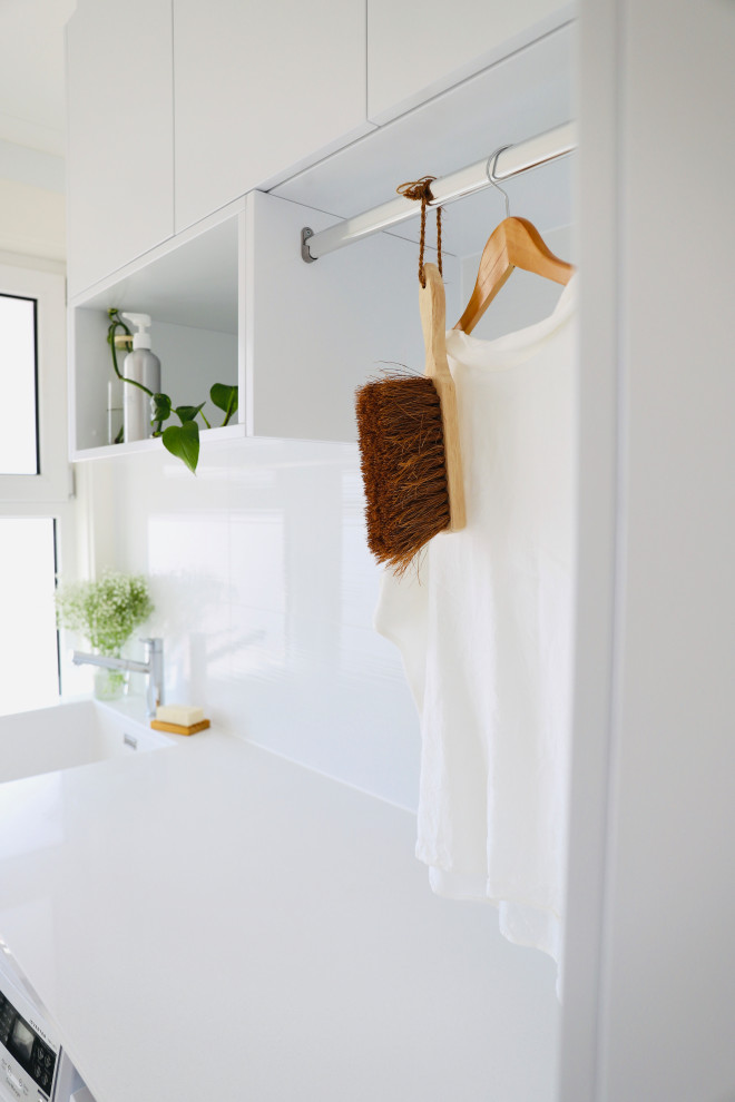 This is an example of a contemporary laundry room in Canberra - Queanbeyan.