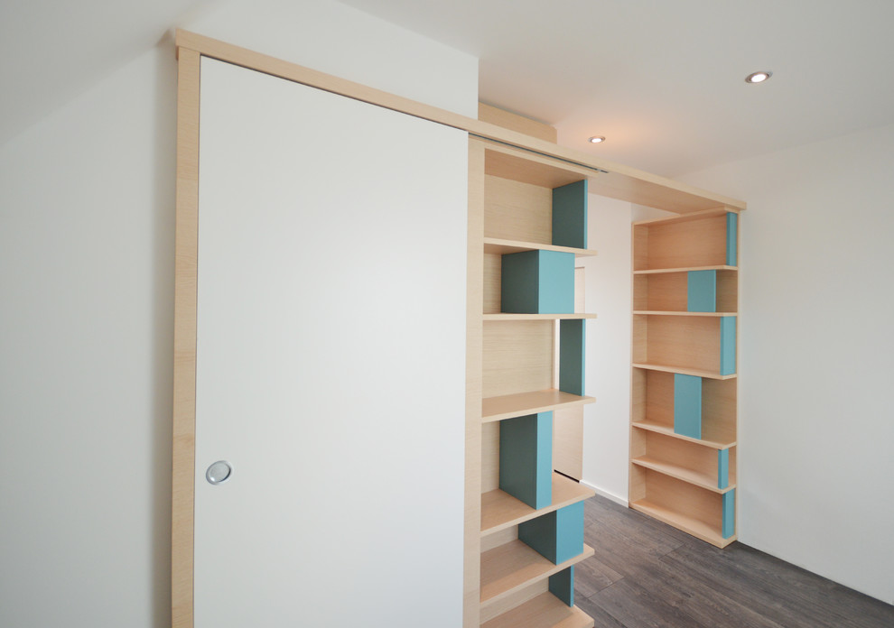 Photo of a mid-sized contemporary master bedroom in Munich with white walls, dark hardwood floors and grey floor.