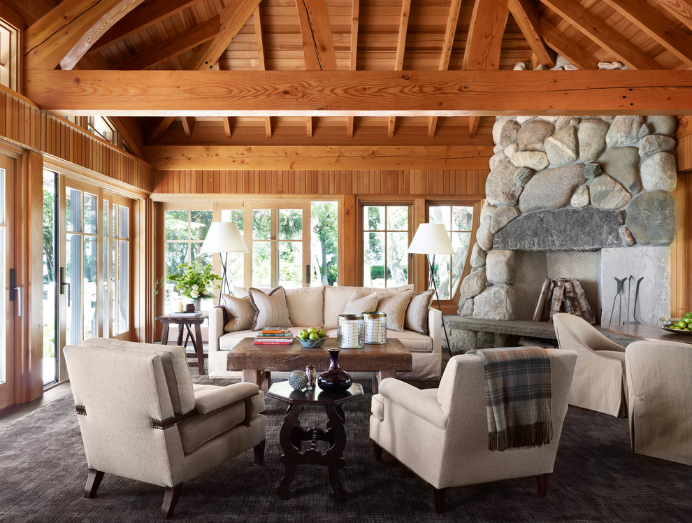 Design ideas for a large country living room in Minneapolis with a stone fireplace surround.