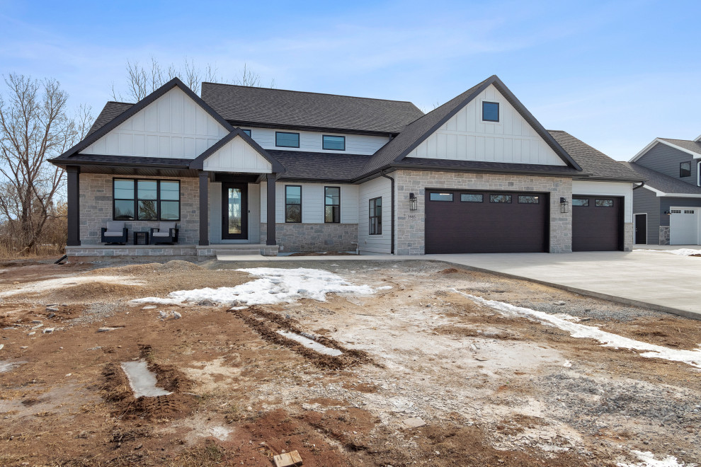 Large transitional white three-story mixed siding and board and batten gable roof idea with a shingle roof and a brown roof