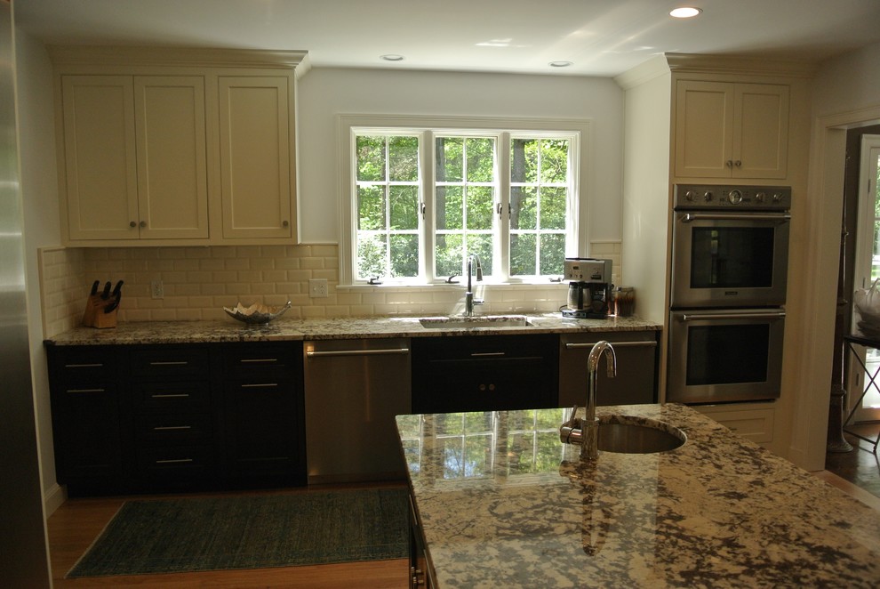 Transitional light wood floor eat-in kitchen photo in Boston with an undermount sink, shaker cabinets, granite countertops, white backsplash, subway tile backsplash, stainless steel appliances and an island