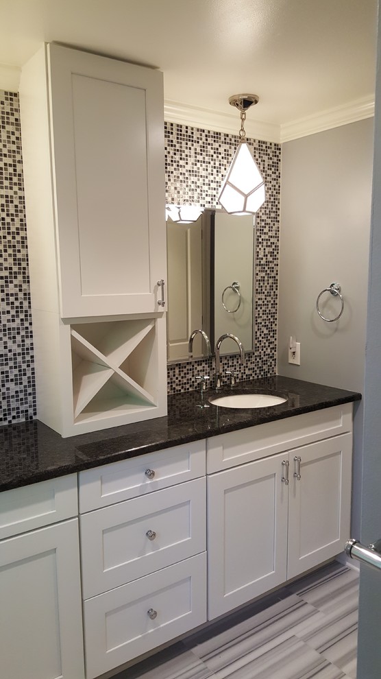 Inspiration for a mid-sized contemporary kids bathroom in Detroit with shaker cabinets, white cabinets, gray tile, black and white tile, an undermount sink, granite benchtops, mosaic tile, grey walls, grey floor and marble floors.