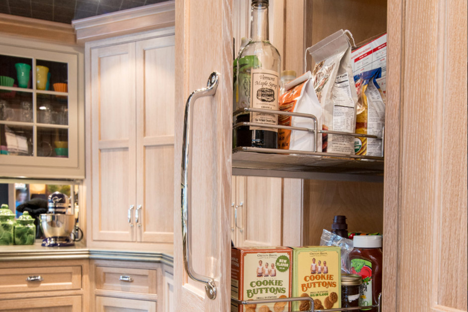 Inspiration for a rustic kitchen remodel in Boston with shaker cabinets, light wood cabinets and mirror backsplash