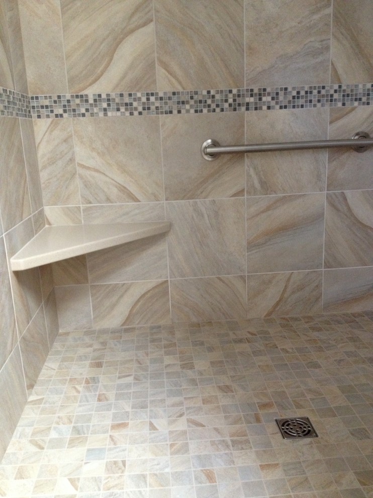 Example of a mid-sized transitional marble tile alcove shower design