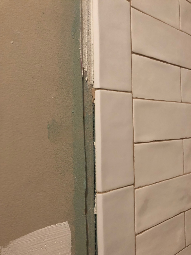 Shower tile transition to drywall what should edge look like?