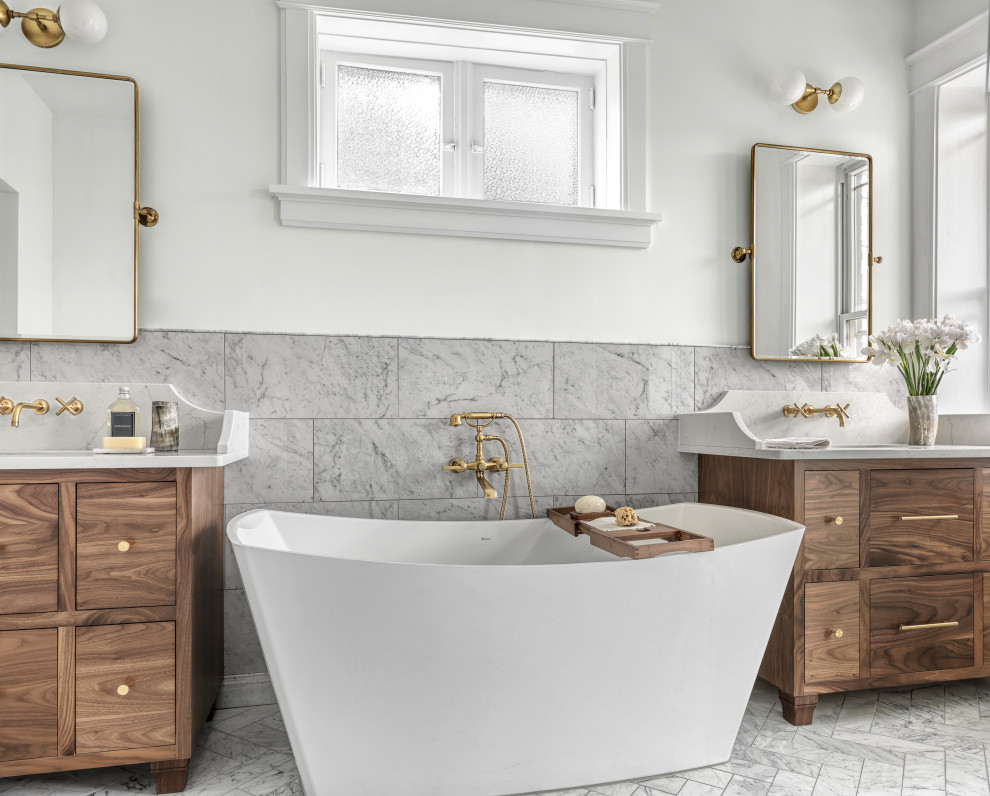 This is an example of a large modern master bathroom in St Louis with flat-panel cabinets, dark wood cabinets, a freestanding tub, an open shower, a two-piece toilet, white tile, marble, white walls, marble floors, an undermount sink, engineered quartz benchtops, white floor, an open shower, white benchtops, an enclosed toilet, a single vanity and a freestanding vanity.