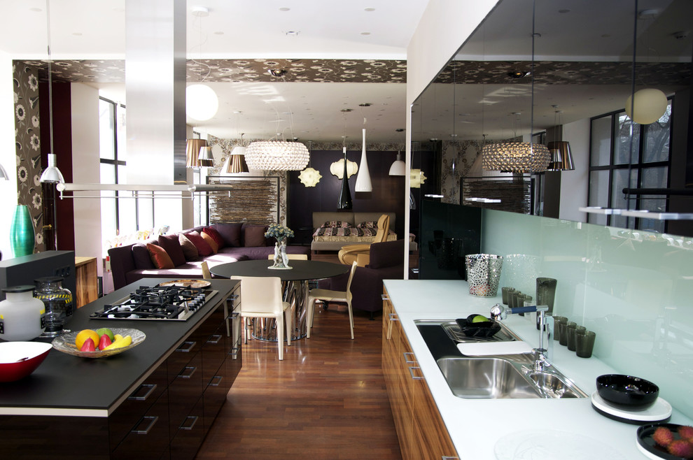 Inspiration for a large modern l-shaped medium tone wood floor and brown floor open concept kitchen remodel in Brussels with a double-bowl sink, louvered cabinets, brown cabinets, stainless steel appliances and an island