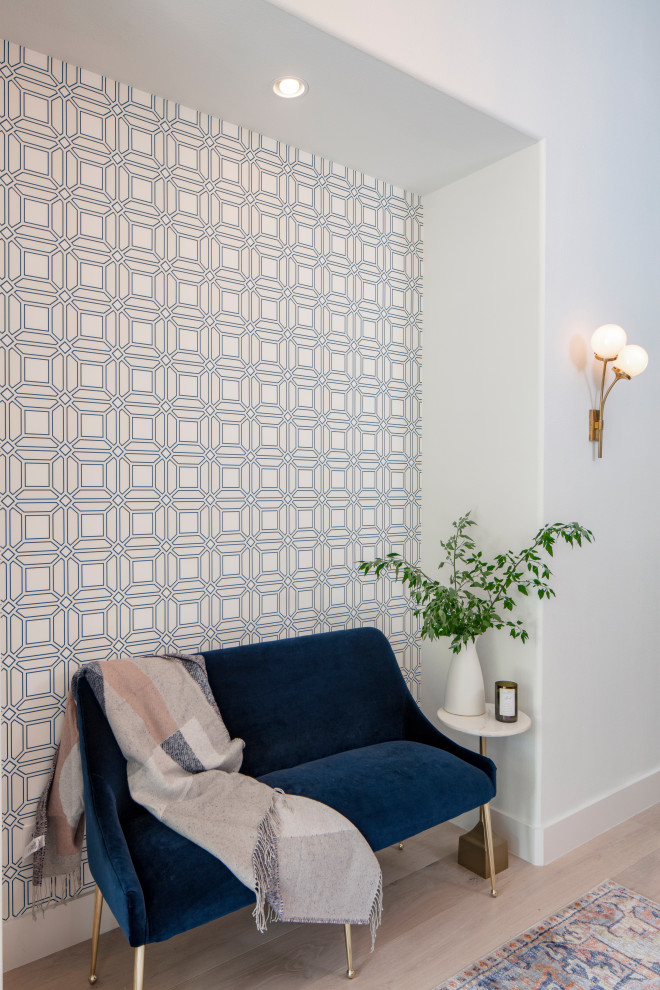 Hallway - mid-sized transitional light wood floor and beige floor hallway idea in Austin with white walls