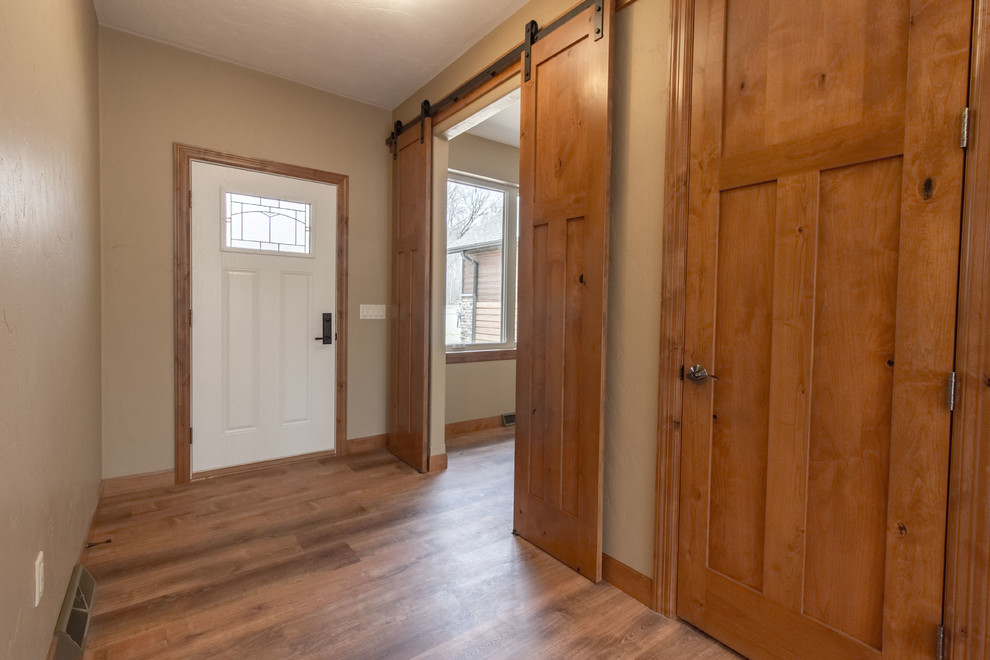 Inspiration for a rustic entryway remodel in Milwaukee