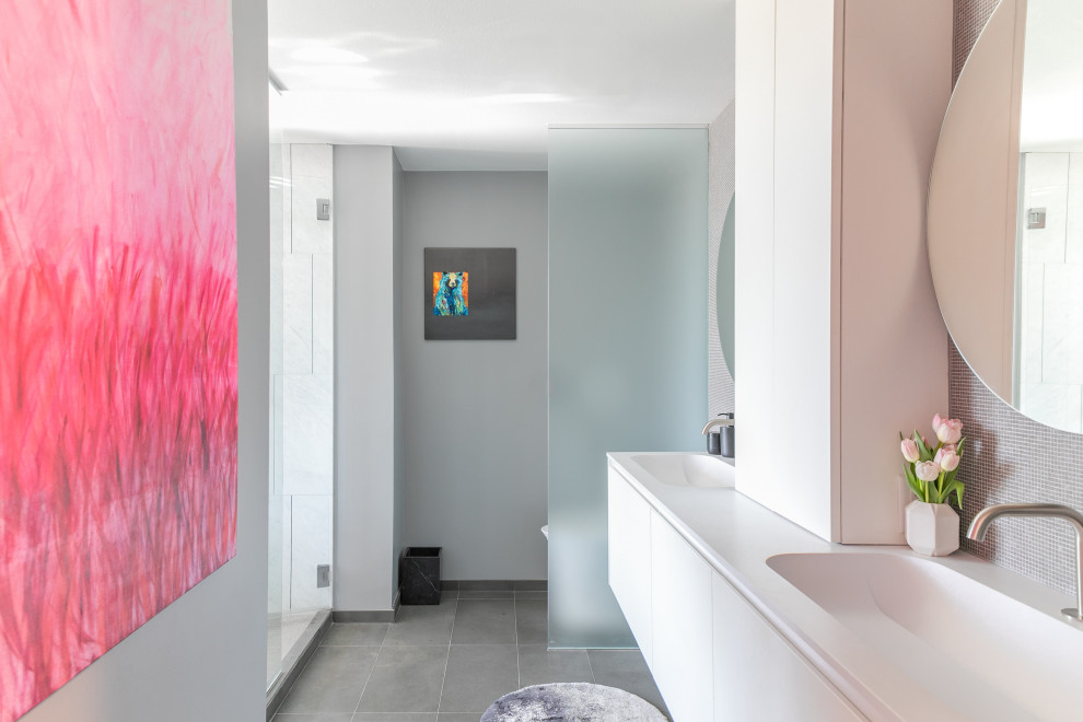Photo of a medium sized contemporary ensuite wet room bathroom in Santa Barbara with flat-panel cabinets, white cabinets, a one-piece toilet, multi-coloured walls, marble flooring, a submerged sink, engineered stone worktops, a hinged door, turquoise worktops, double sinks and a built in vanity unit.