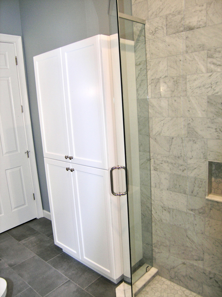 Inspiration for a medium sized traditional family bathroom in Tampa with shaker cabinets, white cabinets, a corner shower, a one-piece toilet, grey tiles, porcelain tiles, grey walls, porcelain flooring, a submerged sink, engineered stone worktops, black floors, a hinged door, grey worktops, a single sink and a built in vanity unit.