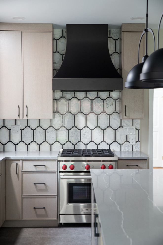Transitional kitchen photo with an island