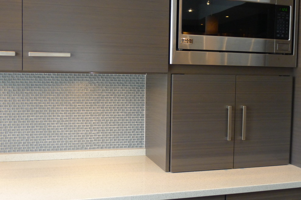 Photo of a large contemporary u-shaped separate kitchen in Indianapolis with an undermount sink, flat-panel cabinets, grey cabinets, quartz benchtops, blue splashback, mosaic tile splashback, stainless steel appliances and with island.