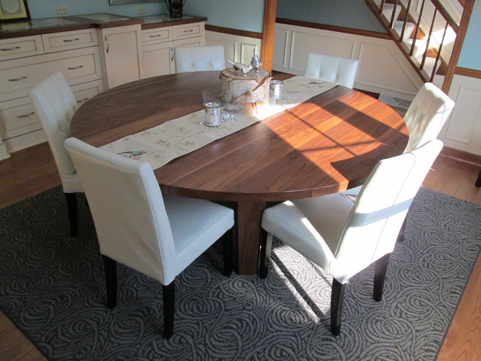 Mid-sized transitional light wood floor kitchen/dining room combo photo with blue walls and no fireplace