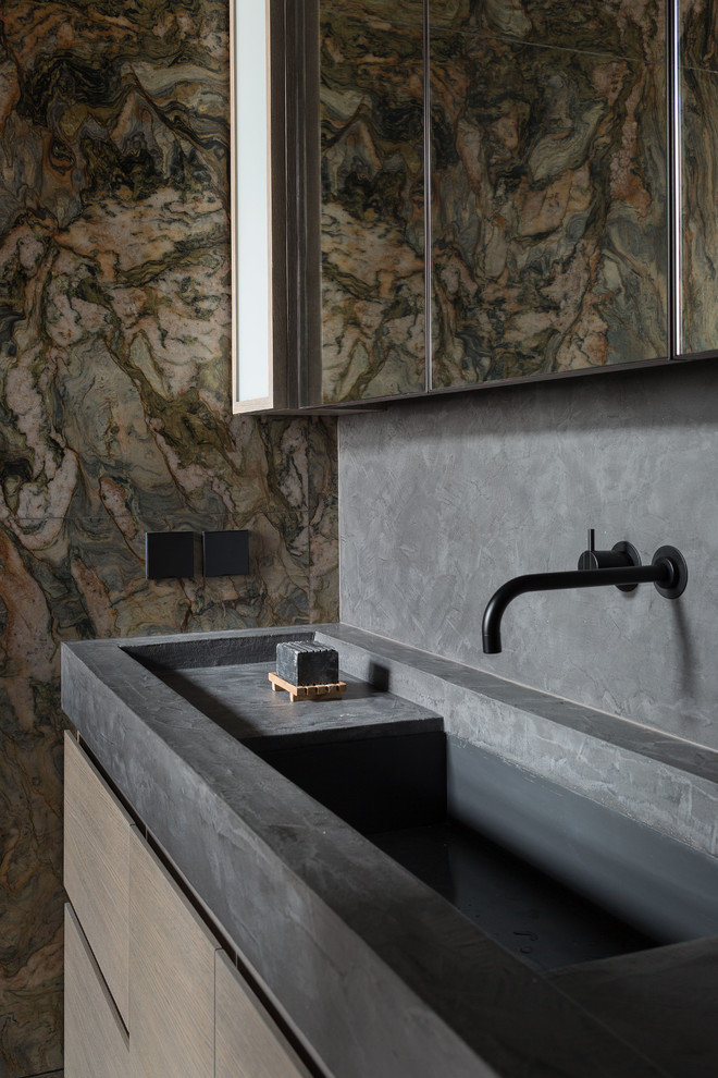 Photo of a large industrial bathroom in Moscow with marble, grey walls, an integrated sink, concrete benchtops and grey benchtops.