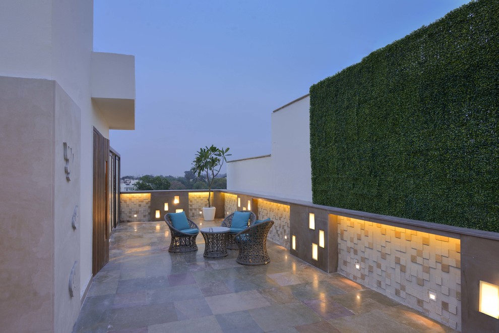 Design ideas for a mid-sized contemporary home design in Delhi.