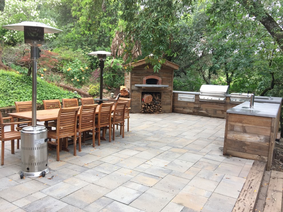 Inspiration for a large transitional backyard patio in San Francisco with concrete pavers and no cover.