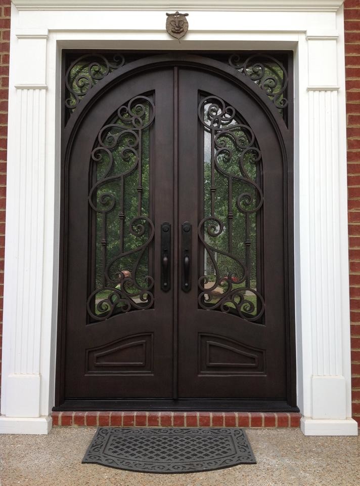 Photo of a large transitional front door in Atlanta with a double front door and a metal front door.