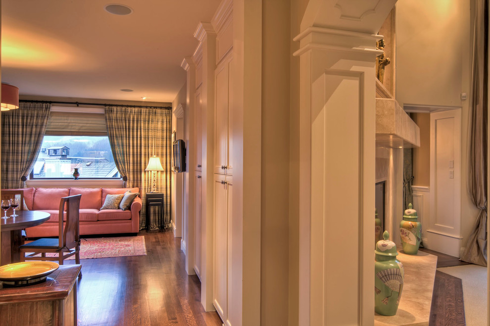 Inspiration for a large transitional medium tone wood floor and brown floor hallway remodel with beige walls