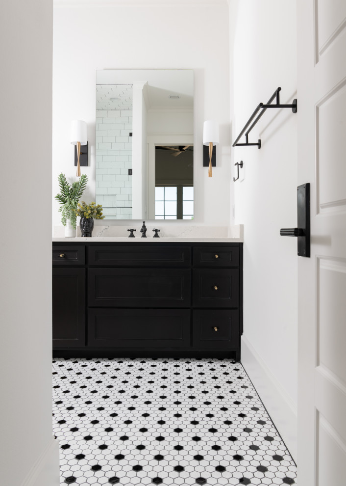 Inspiration for a mid-sized country 3/4 bathroom in Dallas with shaker cabinets, black cabinets, an alcove shower, black and white tile, ceramic tile, white walls, ceramic floors, an undermount sink, engineered quartz benchtops, multi-coloured floor, a hinged shower door, white benchtops, a single vanity and a built-in vanity.