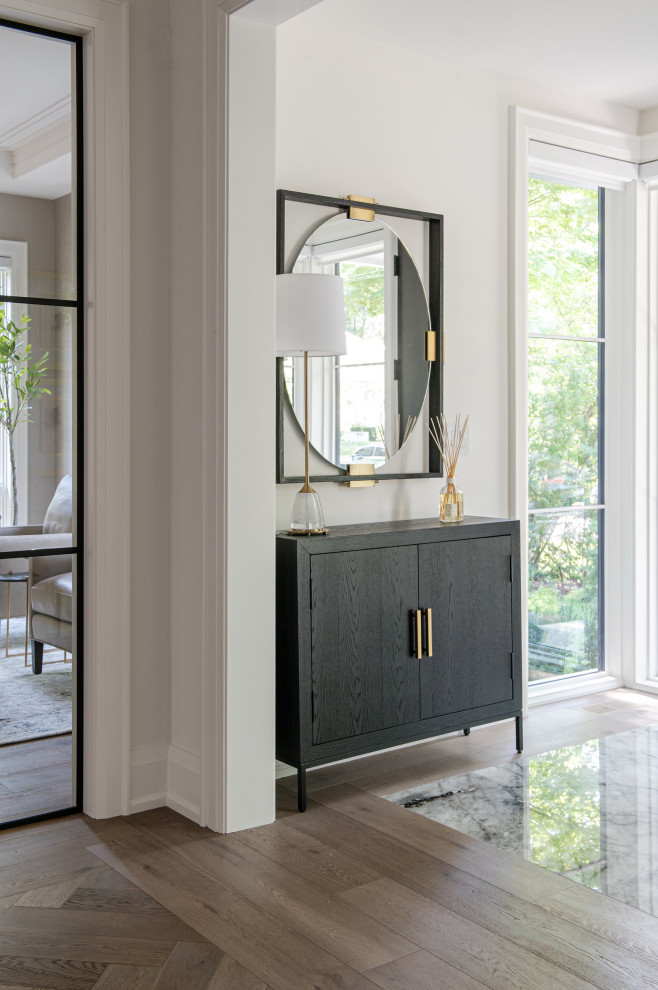 Mid-sized transitional porcelain tile and multicolored floor foyer photo in Toronto with white walls