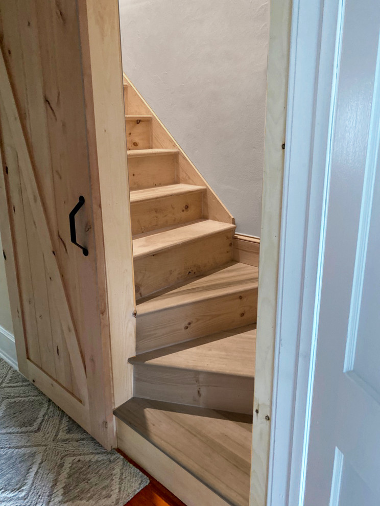 Photo of a small contemporary wood l-shaped staircase in Philadelphia with wood risers and wood railing.