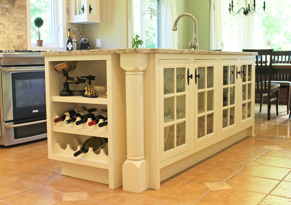 Inspiration for a mid-sized transitional u-shaped open concept kitchen remodel with an undermount sink, beaded inset cabinets, white cabinets, granite countertops, gray backsplash, ceramic backsplash, stainless steel appliances, an island and beige countertops